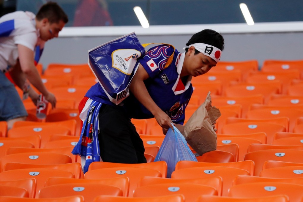 Japanese fans clean up after themselves in Ekaterinburg Arena, Yekaterinburg, after their team’s draw with Senegal. Photo: Reuters