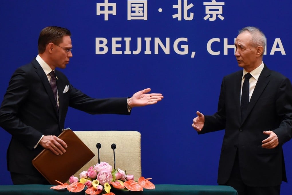 European Commission Vice-President Jyrki Katainen gestures to Chinese Vice-Premier Liu He as they arrive for a joint press conference in Beijing on Monday. Photo: AFP