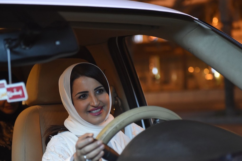 Samar Al-Moqren drives her car through the streets of the Saudi capital Riyadh for the first time just after midnight. Photo: AFP