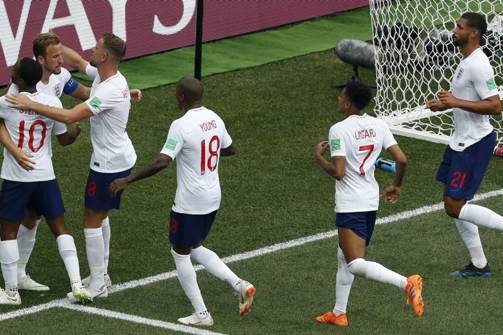 England’s Harry Kane celebrates with teammates after scoring his second penalty during the group G drubbing of Panama. Photo: AP