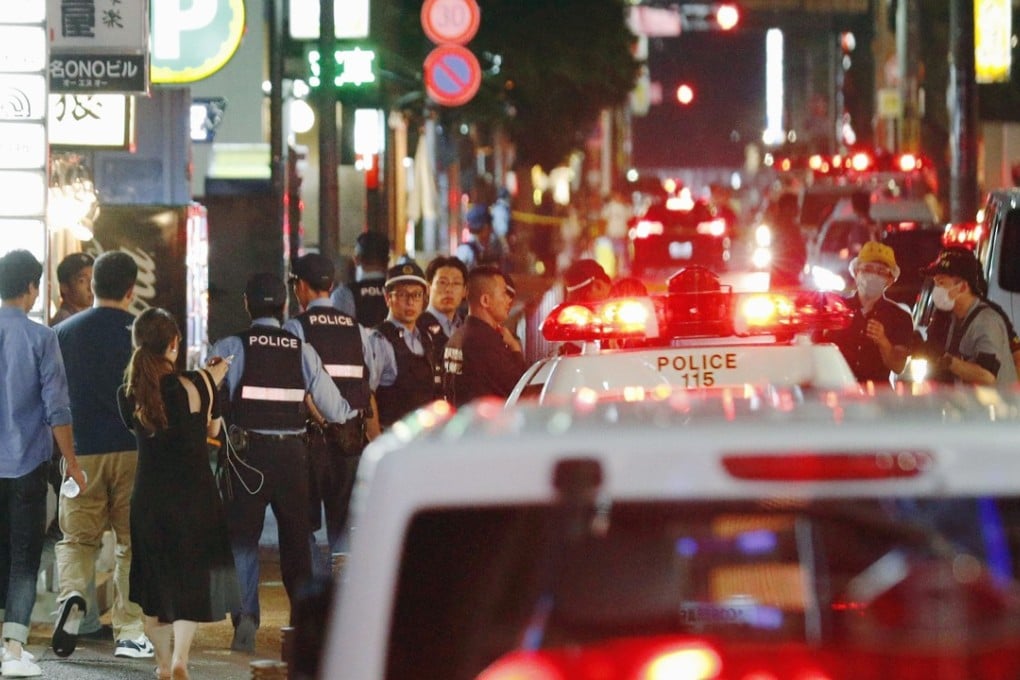 Police at the scene of the stabbing. Photo: Kyodo