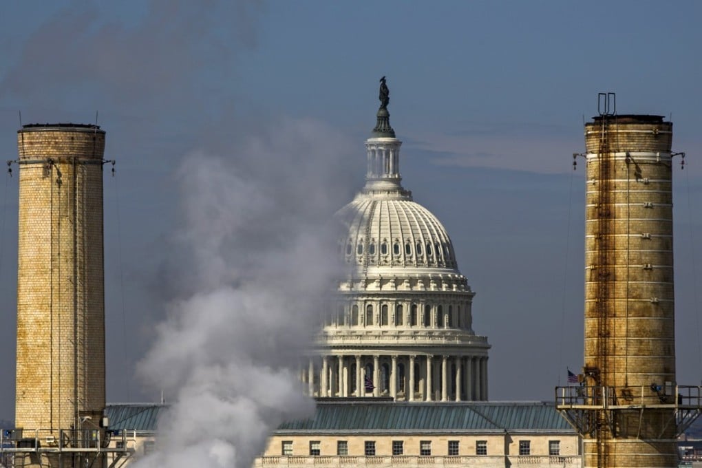 The US Capitol dome is seen behind the smokestacks of the Capitol Power Plant, the only coal-burning power plant in Washington, in 2014. Photo: EPA