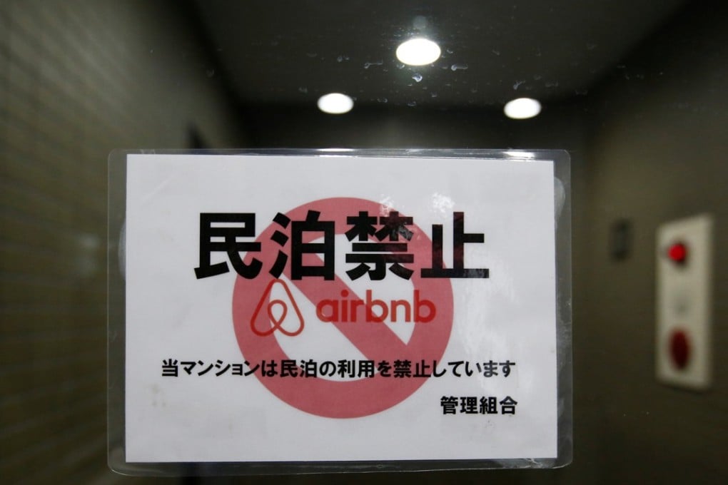 A sign communicating the ban on using the apartment building for Airbnb service in Tokyo. Photo: Reuters