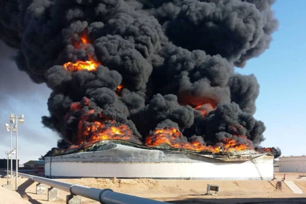 Flames rise from an oil tank amid fighting between rival factions at Ras Lanuf terminal. Marshal Khalifa Hifter announced on Monday that the handover of oil installations under the control of his self-styled army to an administration that rivals Libya’s UN-backed government, after retaking them from militias. Photo: Reuters