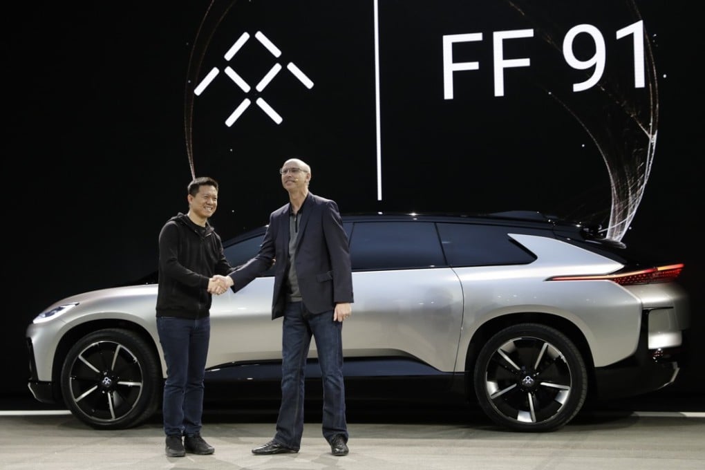 LeEco CEO Jia Yueting (left) and Nick Sampson, Faraday Future’s senior vice-president of product research and development, unveil the FF91 electric car at CES International on January 3, 2017, in Las Vegas. Photo: AP Photo