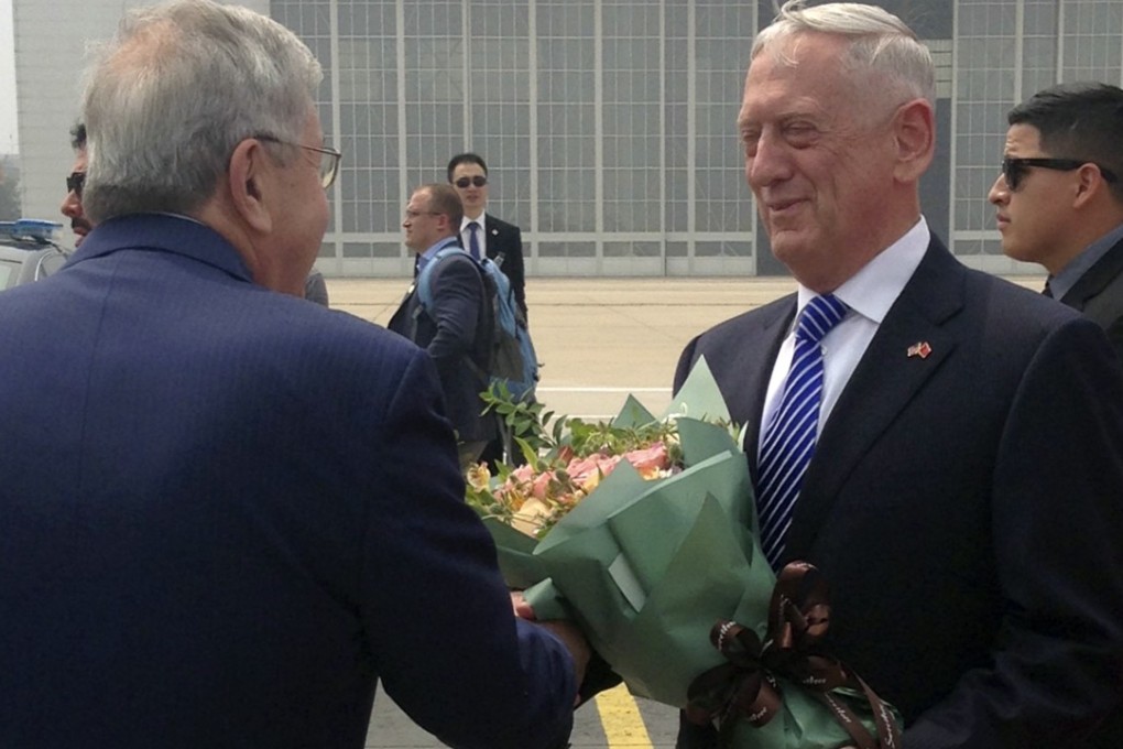US Defence Secretary Jim Mattis is greeted with a floral bouquet as he arrives in Beijing on Tuesday. Photo: AP