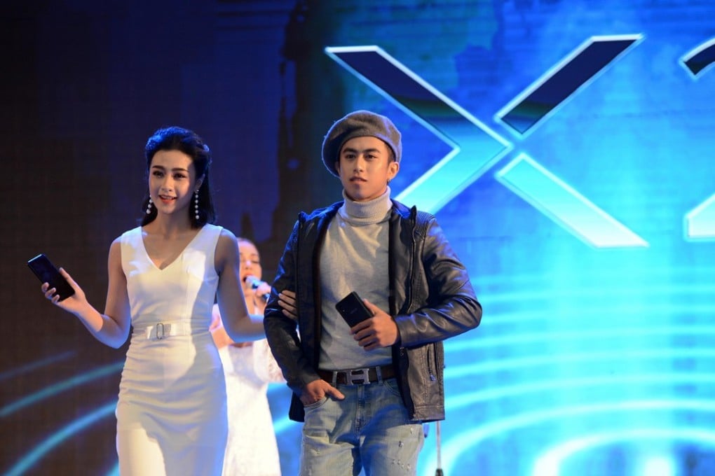 Models present Vivo smartphones during a launch event in Vientiane, Laos, 2018. Photo: Xinhua