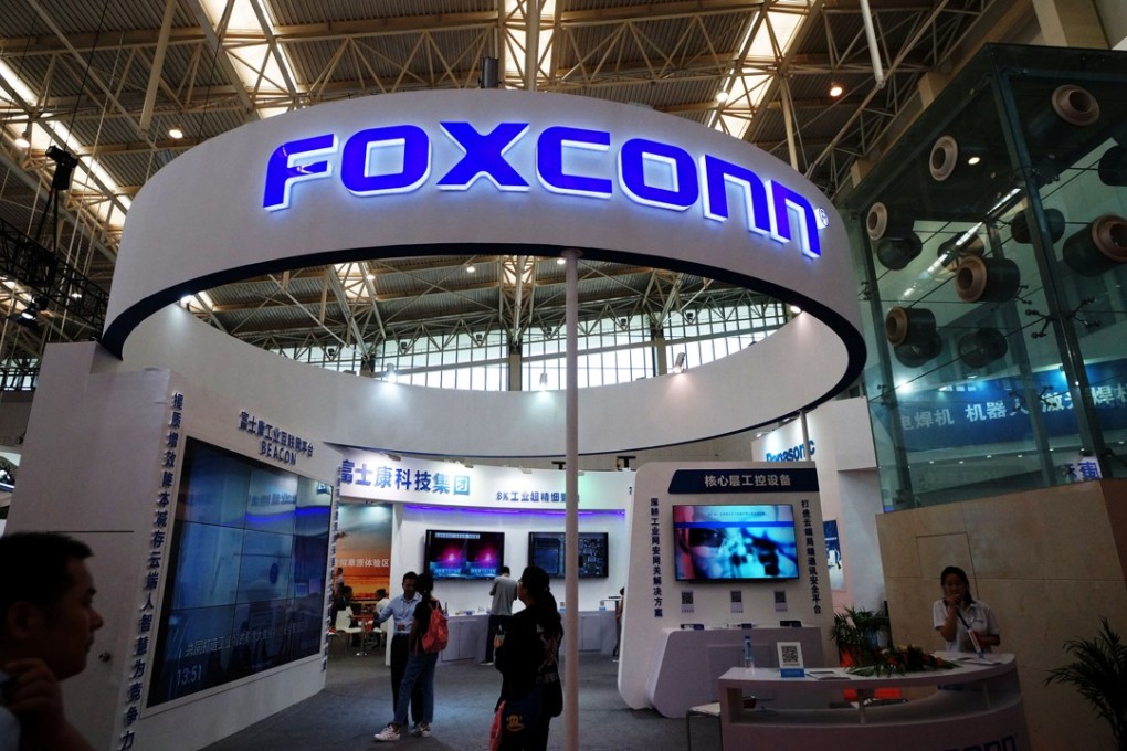 Visitors are seen at a Foxconn booth at the World Intelligence Congress in Tianjin, China May, 2018. Photo: Reuters