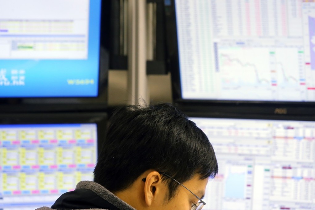 Stockbroker at the Prudential Brokerage in Central on 7 January 2016. Photo: SCMP/ Dickson Lee
