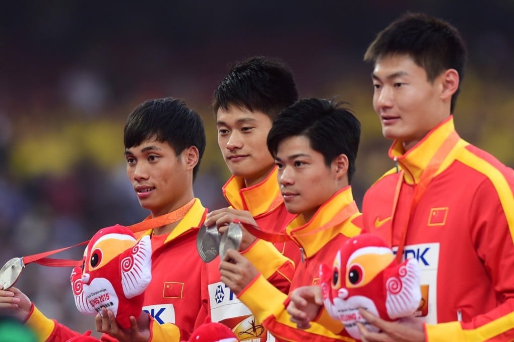 Xie Zhenye (second left) and Su Bingtian (second right) with their teammates after winning silver in the 4x100m at the 2015 IAAF World Championships. Photo: Xinhua
