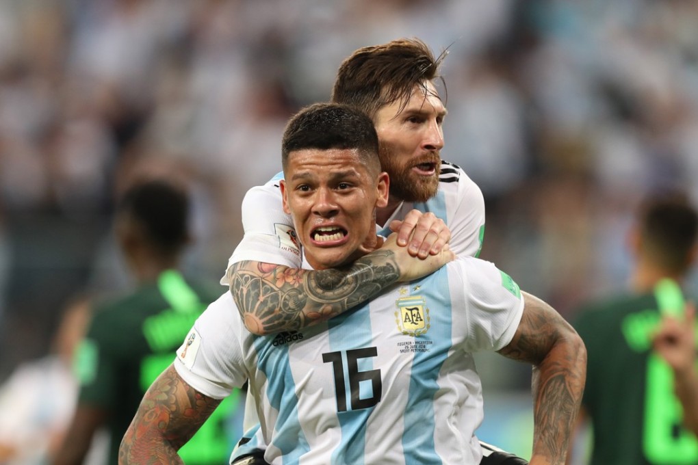 Argentina's Marcos Rojo celebrates scoring with Lionel Messi. Photo: Xinhua