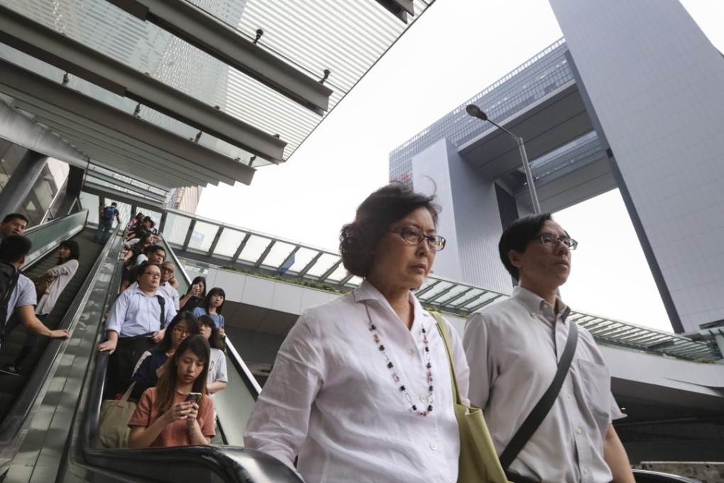 Outside the government offices in Tamar. Last week, Hong Kong’s Executive Council decided that the age of mandatory retirement for more civil servants would be raised from 60 to 65, while that for disciplined services staff will be raised from 55 to 60. Photo: Felix Wong