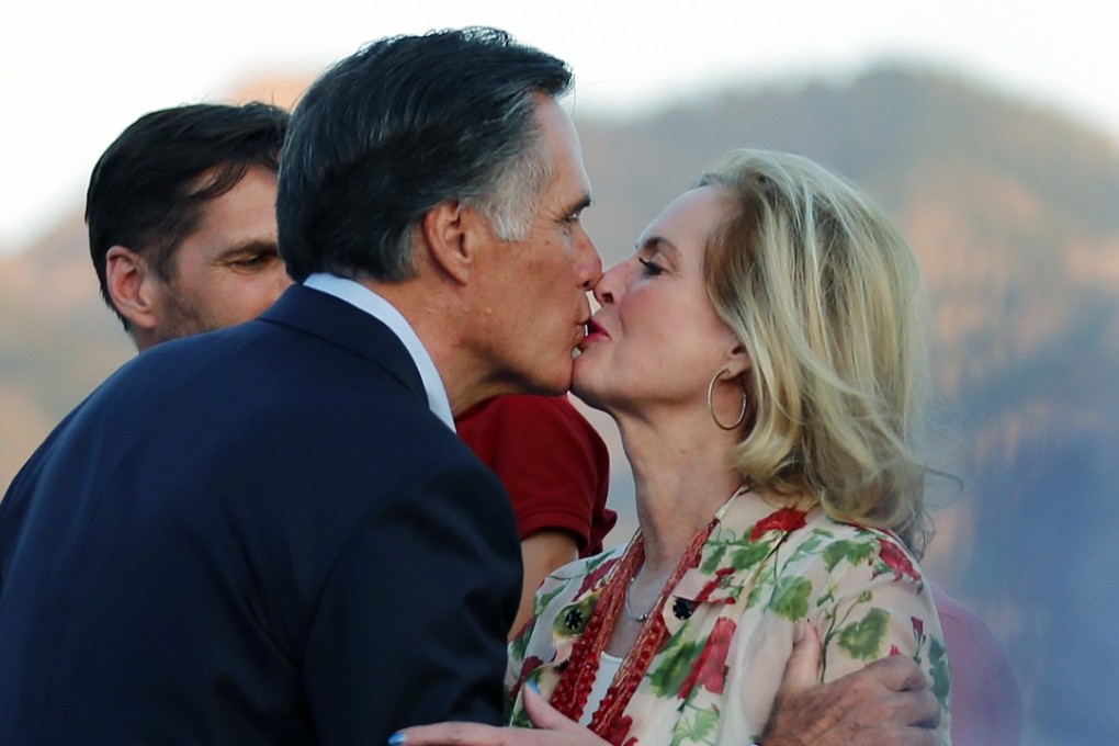 Former Republican presidential candifdate Mitt Romney kisses his wife, Ann, after addressing supporters at their campaign headquarters during a primary election night party on Tuesday in Orem, Utah. Photo: AP