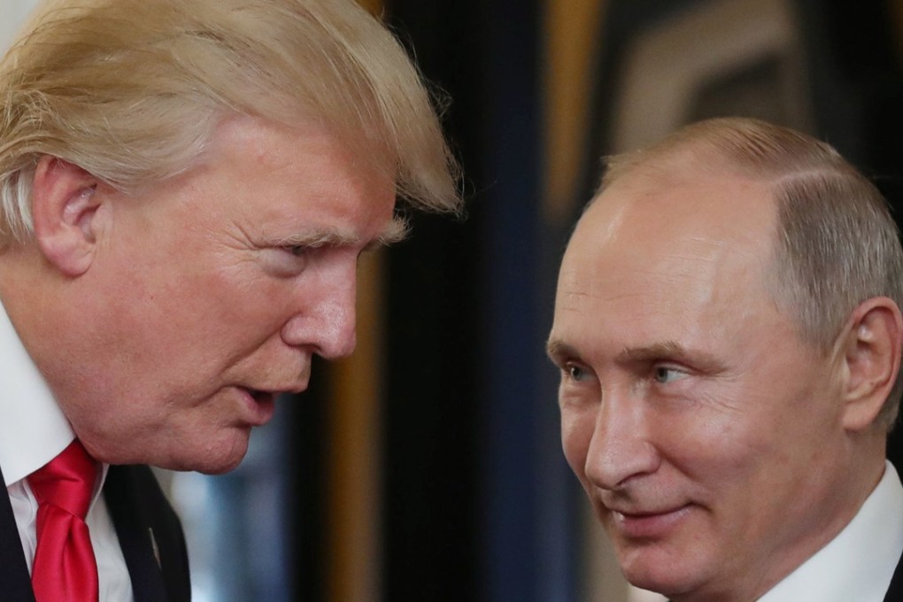 US President Donald Trump chats with Russia's President Vladimir Putin as they attend the APEC Economic Leaders' Meeting. The two will meet again at a summit at a third location. Photo: AFP