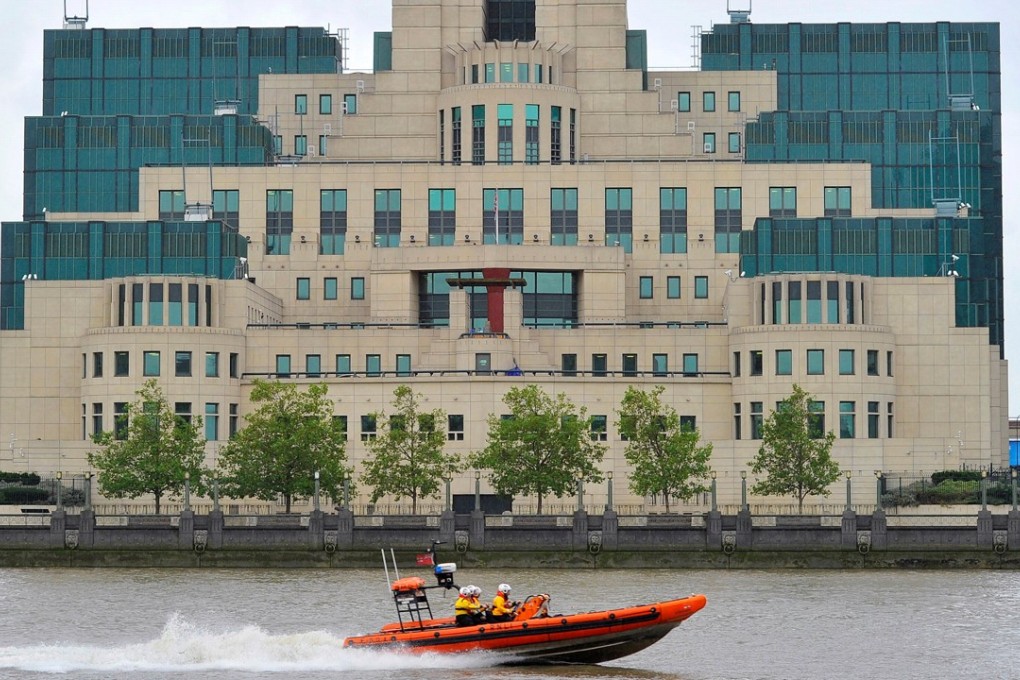 A motorboat passes by the MI6 building in London. Photo: Reuters