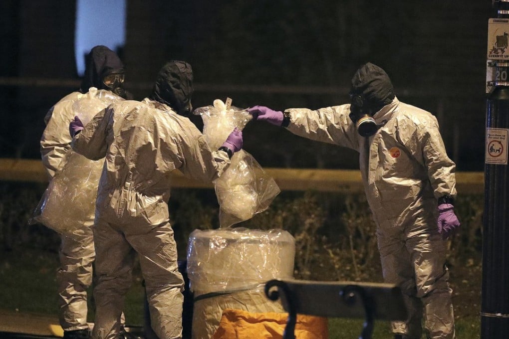 Investigators in protective suits work at the scene of the poisoning of a former Russian double agent and his daughter in Salisbury, England, on March 13. Photo: PA via AP
