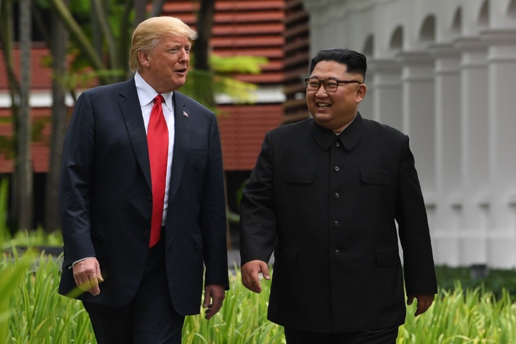 North Korea’s leader Kim Jong-un (right) walks with US President Donald Trump during a break in talks at their historic US-North Korea summit, at the Capella Hotel on Sentosa island in Singapore on June 12. Trump and Kim became the first sitting US and North Korean leaders to meet to negotiate an end to the decades-old nuclear stand-off on the Korean peninsula. Photo: AFP