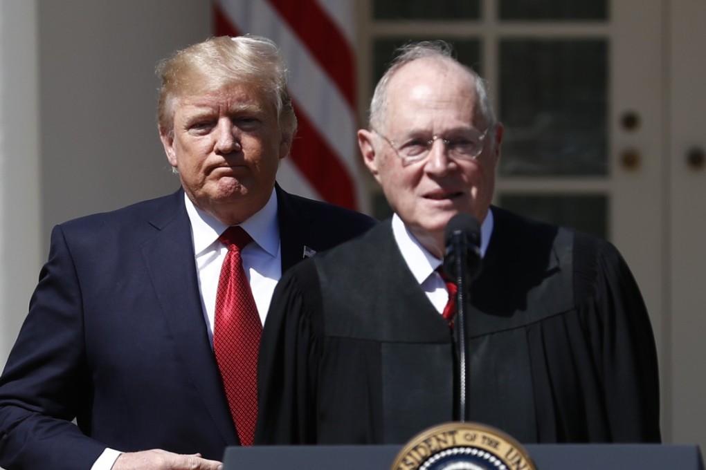 In this April 10, 2017, file photo, US President Donald Trump, left, and Supreme Court Justice Anthony Kennedy participate in a public swearing-in ceremony for Justice Neil Gorsuch in the Rose Garden of the White House. Photo: AP