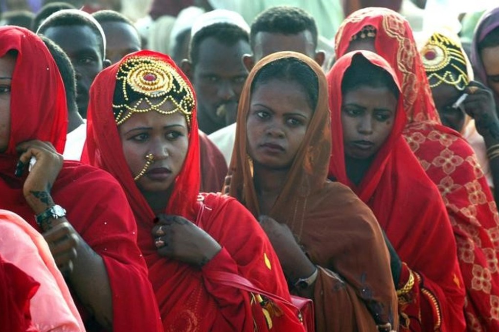 Sudanese women line up during a wedding ceremony in 2006. Photo: Retuers