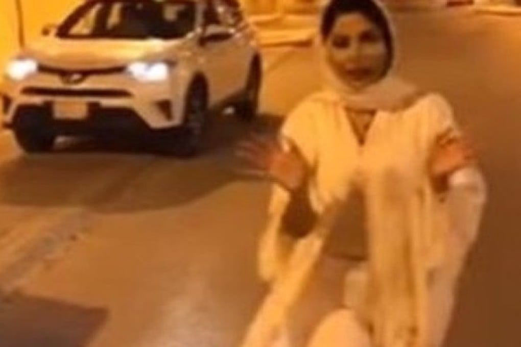 Shireen al-Rifaie, a Saudi presenter with Dubai-based Al Aan TV, appears in a widely-circulated video wearing a loose headscarf and a partly open gown that revealed her trousers and a blouse. Photo: Al Aan TV