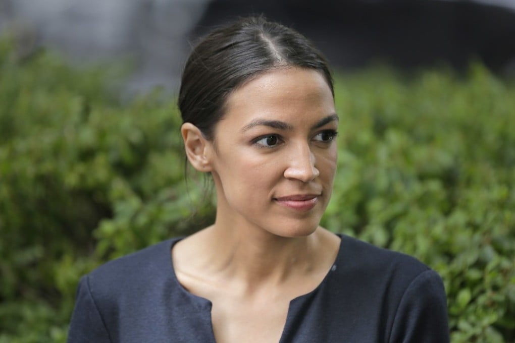 Political newcomer Alexandria Ocasio-Cortez takes a moment between interviews in New York on Wednesday, the day after her upset of an incumbent US House member in New York's Democratic primary. Photo: AP