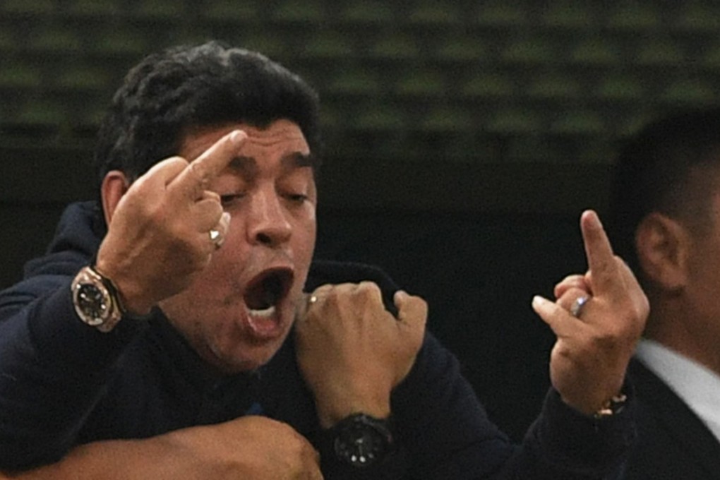 Diego Maradona makes an obscene gesture as he celebrates Argentina’s late winner against Nigeria. Photo: AFP