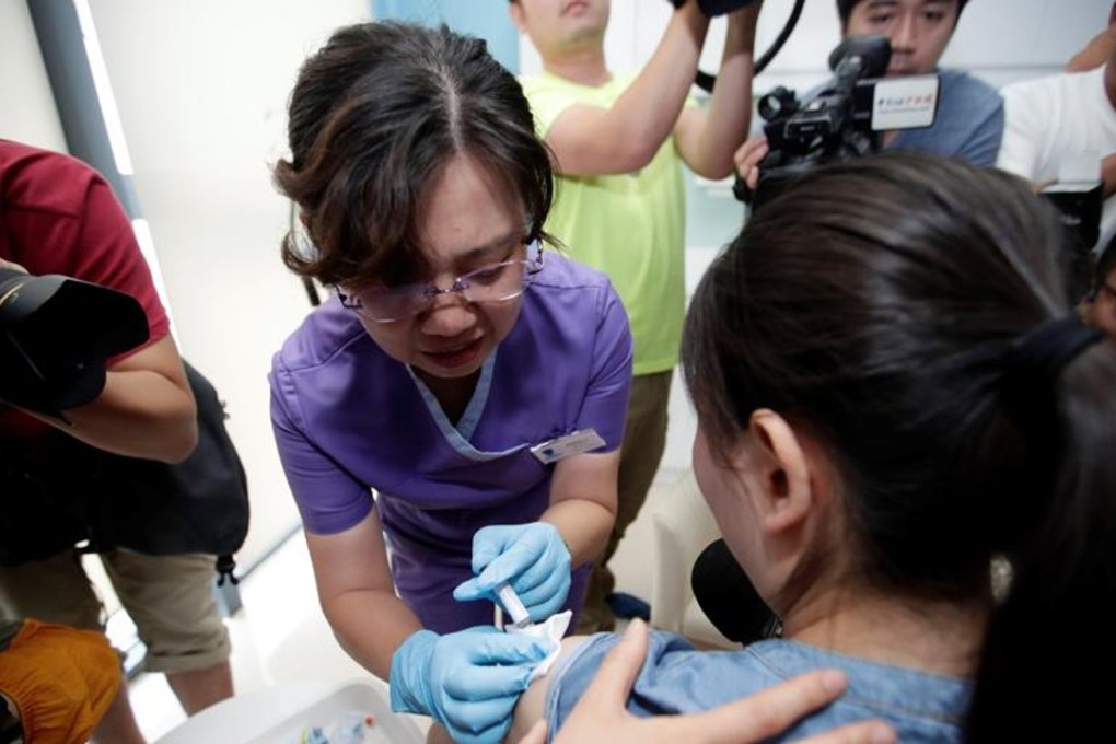 A woman from Beijing receives the Gardasil 9 HPV vaccine at a hospital in Hainan province on May 30, becoming the first person to obtain the injection in mainland China. Picture: Reuters