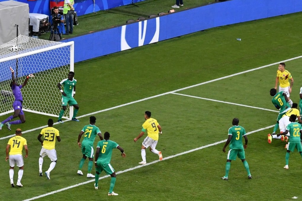 Colombia defender Yerry Mina (right) rifles in a header to give Colombia the win over Senegal. Photo: AFP