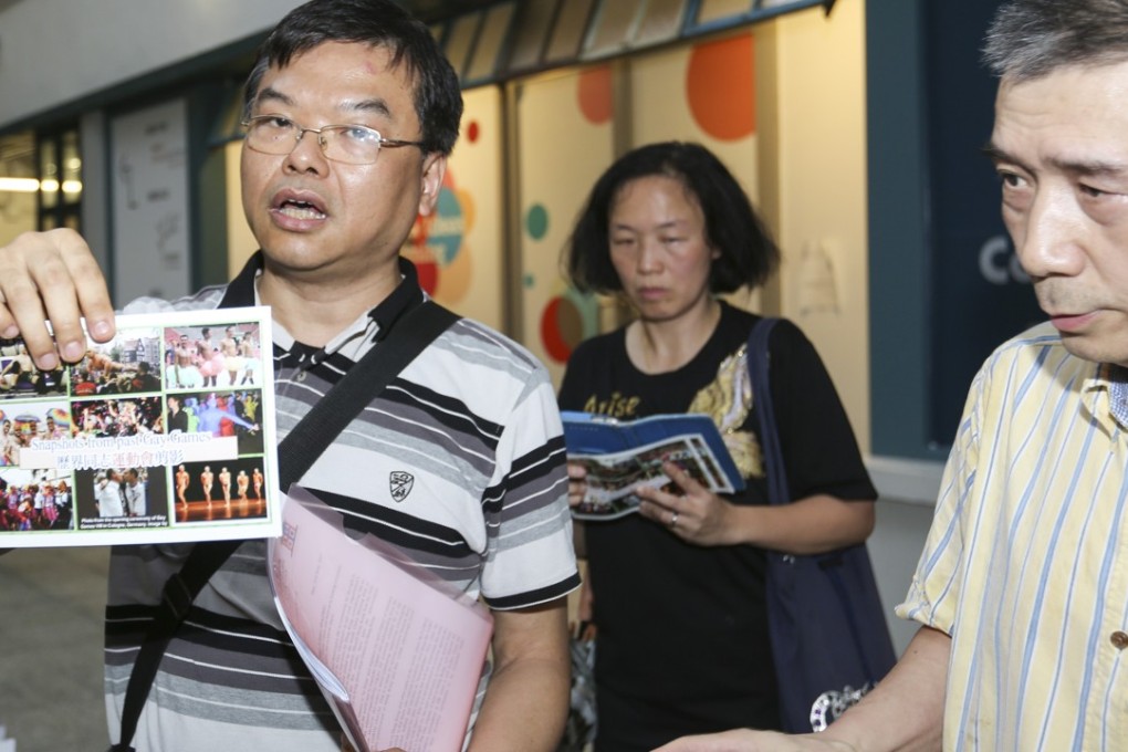 Family School Sodo Concern Group convenor Roger Wong (left) helps to hand out flyers at Aberdeen Street in Central in June 2017, opposing the city's bid to host the Gay Games in 2022. Hong Kong won its bid to be the Games’ first Asian host. Photo: Xiaomei Chen