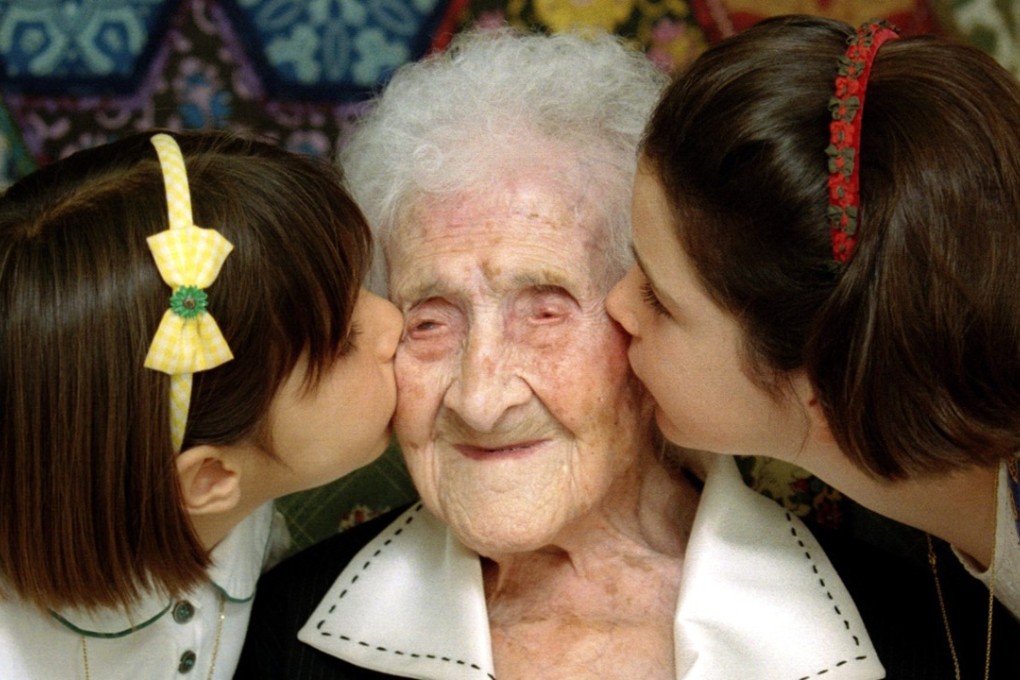 Jeanne Calment is kissed by two young girls during a special ceremony in a retirement home in Arles, Southern France, in 1995, when she was 120 years old. She died aged 122 years, 164 days, and is the longest-lived human ever reliably recorded. Photo: Reuters