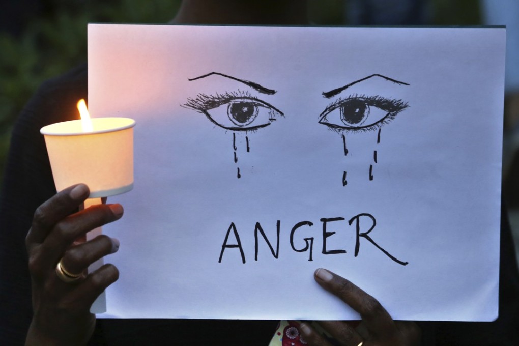 A woman joins a rally calling for an end to sexual violence, in Bangalore on April 16. Photo: AP