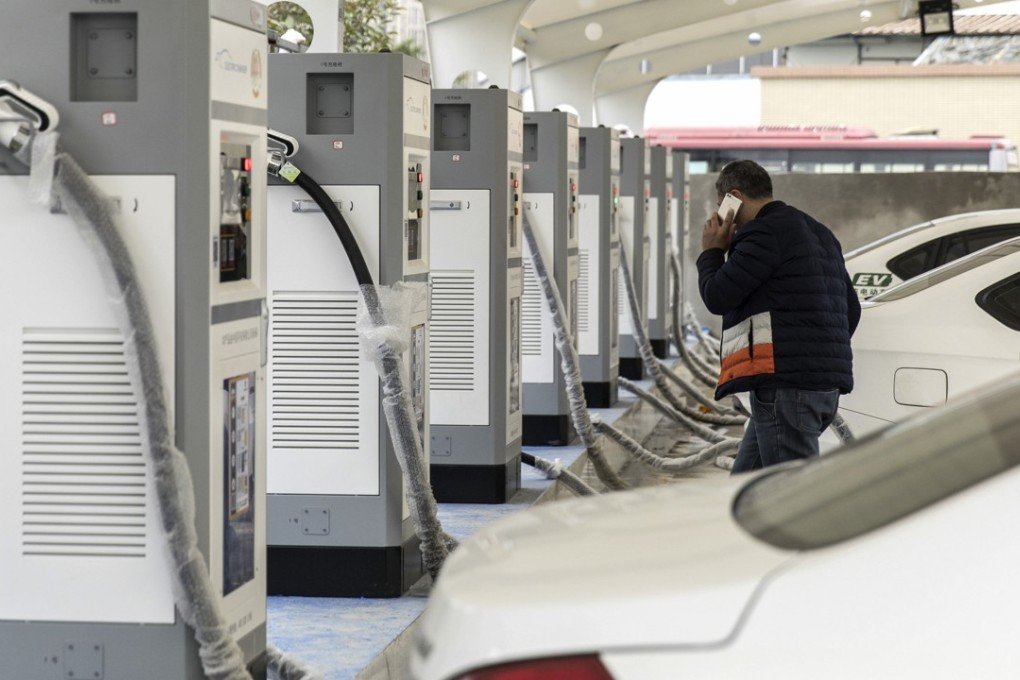 Electric taxis stand at a charging station operated by an electric vehicle showroom in Ningde in Fujian Province on Monday, January 29, 2018. China surpassed the US in 2015 to become the world's biggest market for electric cars. Sales of new-energy vehicles - including battery-powered, plug-in hybrid and fuel-cell vehicles - reached 777,000 units last year and could surpass 1 million this year, the China Association of Automobile Manufacturers estimated. Photo: Qilai Shen/Bloomberg