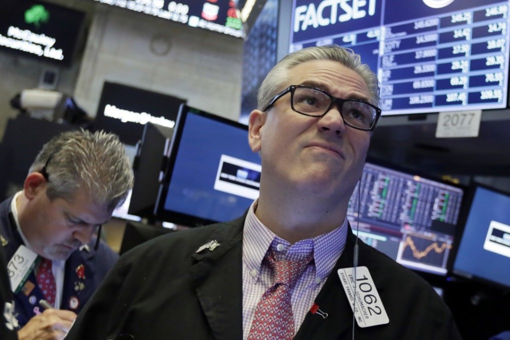 Traders work on the floor of the New York Stock Exchange on June 26, a day of mixed results for US stocks. Photo: AP