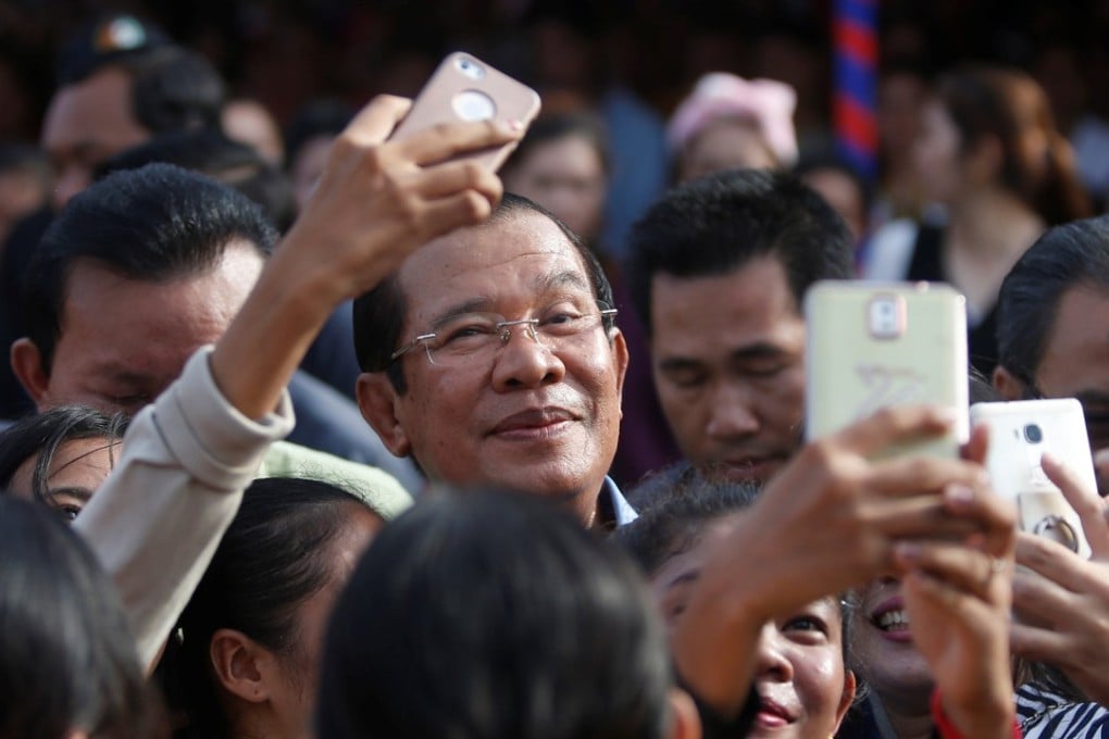 Garment workers welcome Cambodian Prime Minister Hun Sen during a rally in Kandal province. Photo: Reuters