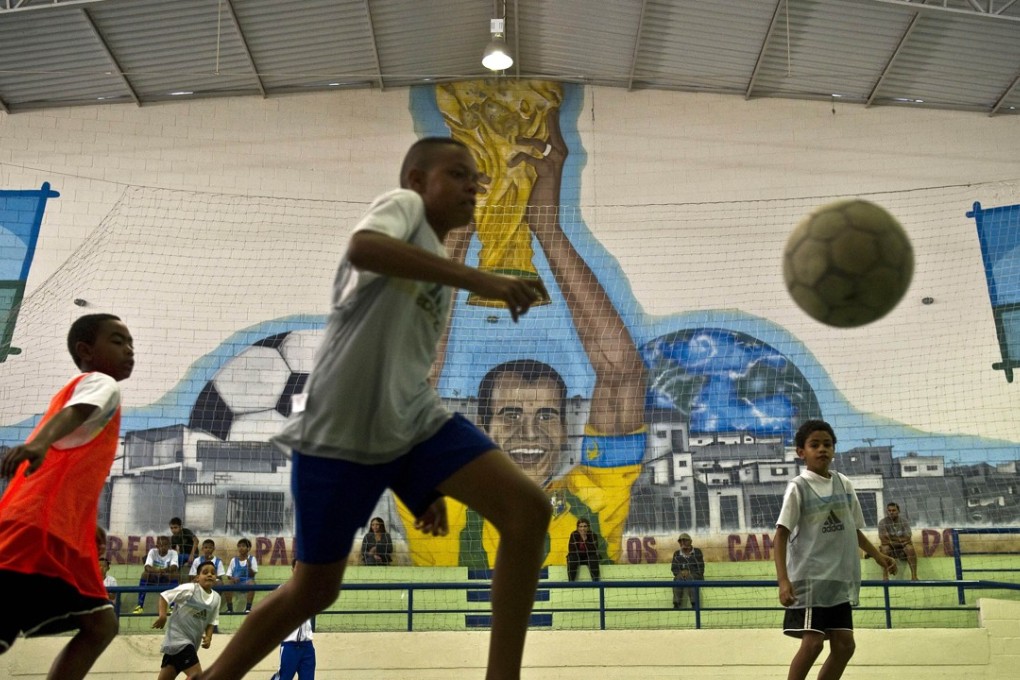 Children playing futsal at the Cafu Foundation in Sao Paulo in 2013. Photo: AFP
