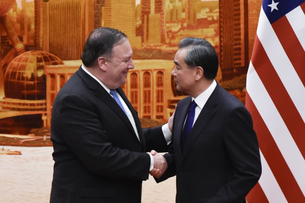 US Secretary of State Mike Pompeo shakes hands with Chinese Foreign Minister Wang Yi after a joint press conference at the Great Hall of the People in Beijing on June 14, 2018. Photo AFP