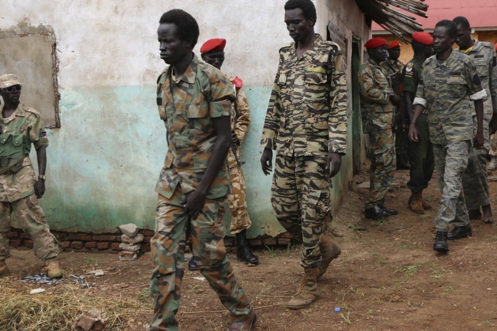 South Sudanese soldiers accused of a horrific attack on foreign aid workers including rape, torture, killing and looting taken to prison earlier this month. Both sides South Sudan’s civil war broke an agreed ceasefire hours after it was signed. Photo: AP