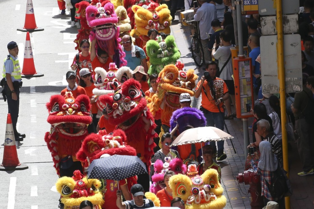 The Hong Kong Celebrations Association organised a lion dance procession from Quarry Bay Park to Victoria Park. Photo: David Wong