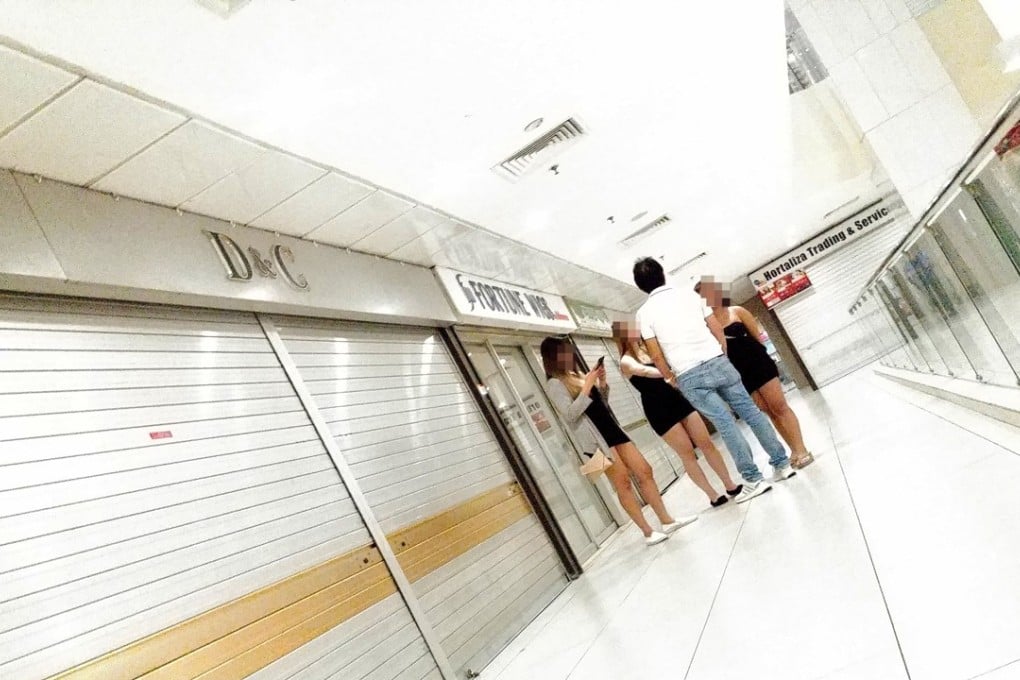 Bar hostesses at Lucky Plaza in Singapore. Photo: C. Lee