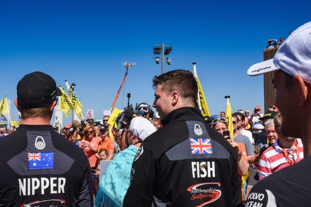 Ryan Fisher (centre), son of missing sailor John Fisher, about to take part in the in-port race for Scallywag. Photo: VOR