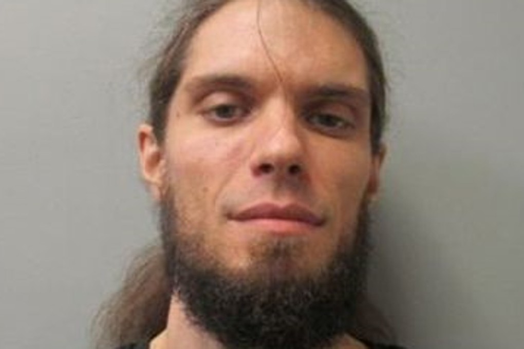 Shane Ryan Sealy, who pulled a gun at an anti-Trump immigration rally, has been booked into jail in Alabama on misdemeanour charges of menacing and reckless endangerment. Photo: Madison County Jail