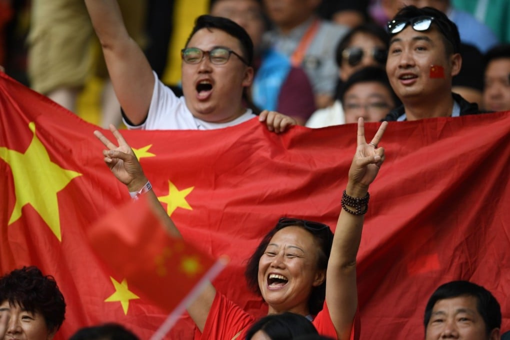 China fans cheer during the Russia 2018 World Cup group G match between Belgium and Tunisia. Photo: AFP