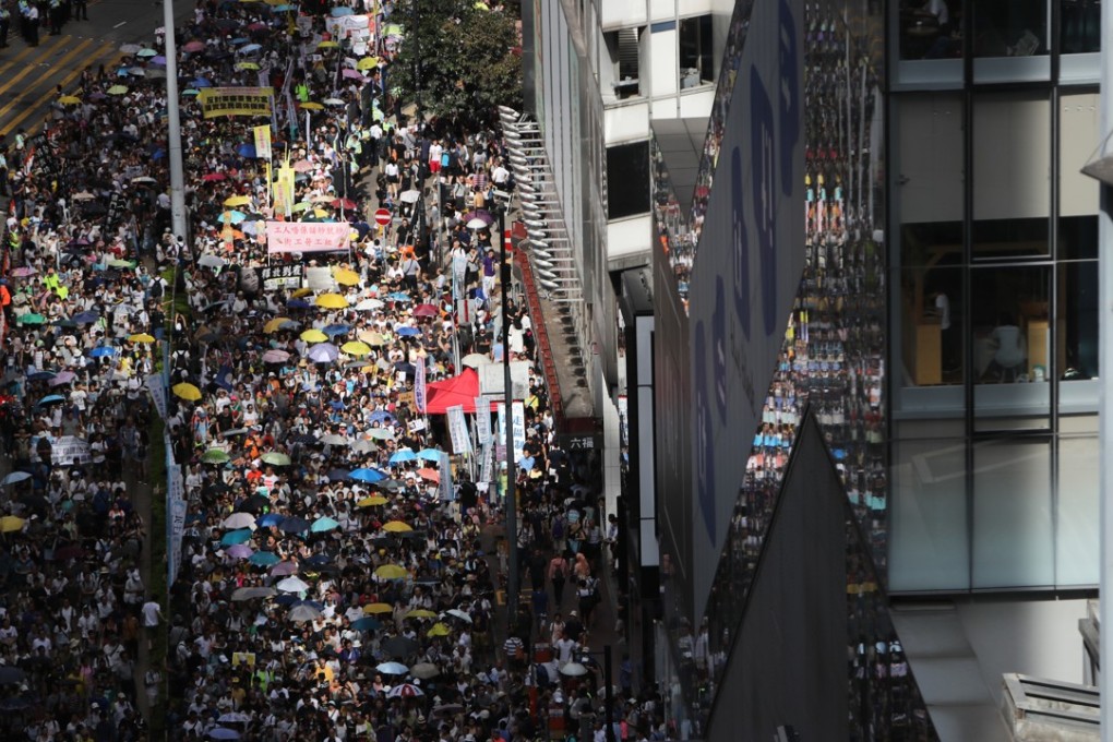 Thousands march through Causeway Bay for the annual July 1 rally. Photo: Winson Wong