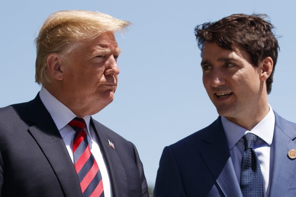 US President Donald Trump talks with Canadian Prime Minister Justin Trudeau during a G-7 Summit welcome ceremony in Charlevoix, Canada, on June 8. Photo: AP