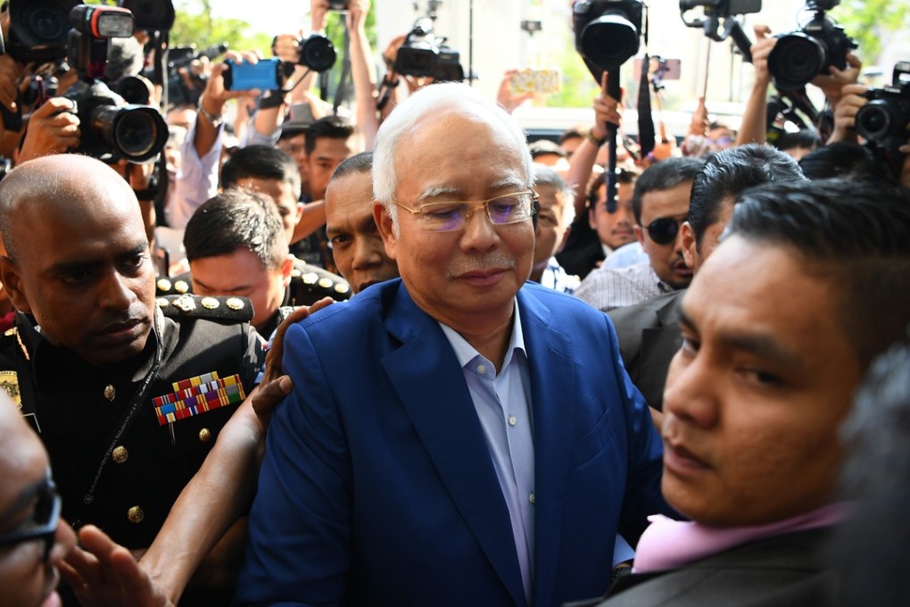 Najib Razak arrives at the Malaysian Anti-Corruption Commission for questioning last month. So far, there have been no public images of his arrest. Photo: AFP