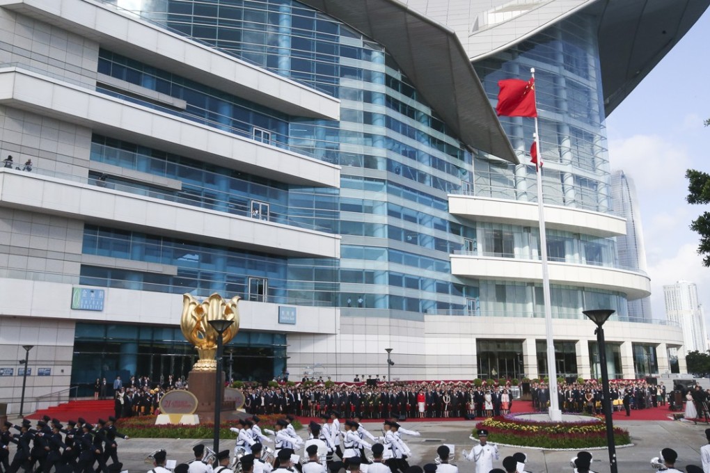 The Chinese flag is raised in Golden Bauhinia Square at a ceremony to mark the 21st anniversary of the city’s return from Britain to China. Photo: David Wong
