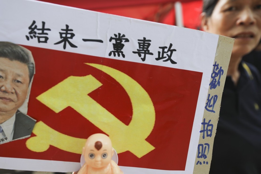 A placard demands an end to “one-party rule”, as demonstrators march in Hong Kong’s July 1 rally from Victoria Park to the government headquarters in Admiralty. The annual march marks the 1997 handover of Hong Kong, a former British colony, to Beijing. This year’s theme was “End one-party dictatorship, reject the fall of Hong Kong”. Photo: Sam Tsang