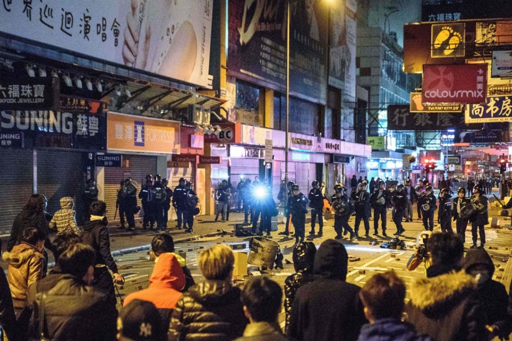 Violence broke out after a hawker control operation in one of the city’s most popular shopping districts turned ugly. Photo: AFP