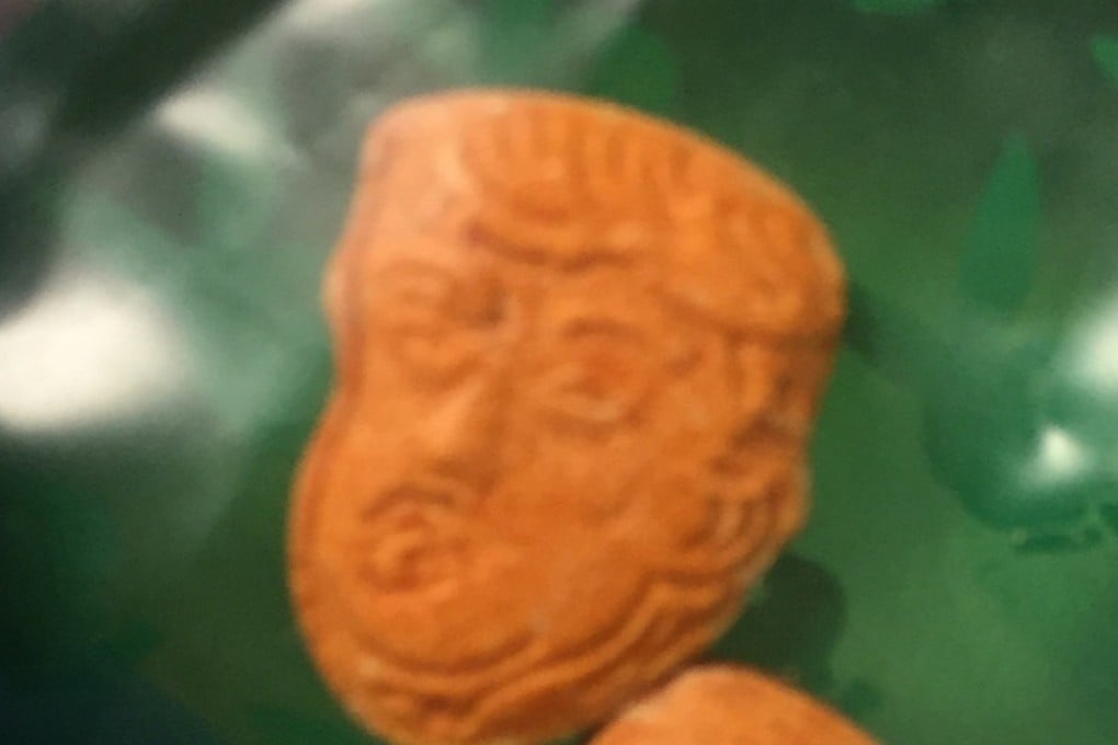 An image provided by the Indiana State Police shows what police describe as ‘Trump-shaped ecstasy pills’. On the back of the orange tablet are the words "great again". Photo: Indiana State Police Peru Post via AP