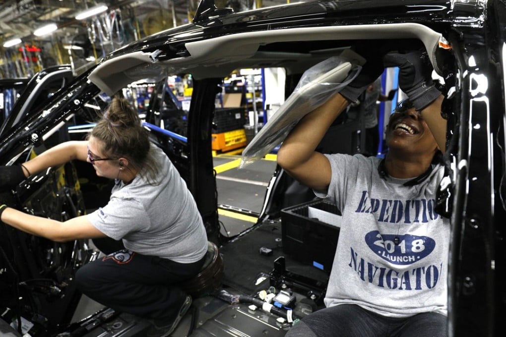 Ford workers install visors into the all-new 2018 Ford Expedition SUV as it goes through the assembly line at a plant in Louisville, Kentucky. The Alliance of Automobile Manufacturers, which represents major carmakers, warned that the tariffs on imported vehicles and automobile components will harm US economic security and national security. Photo: AFP